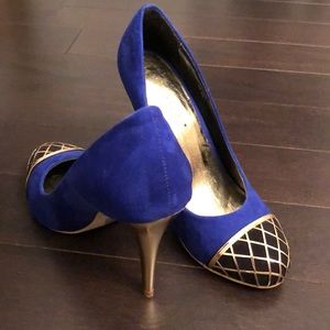 Blue and Back Cap Toe Gold Pumps